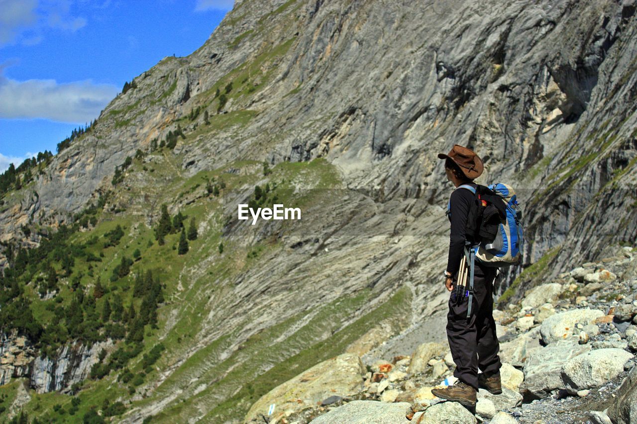 Man standing against mountains