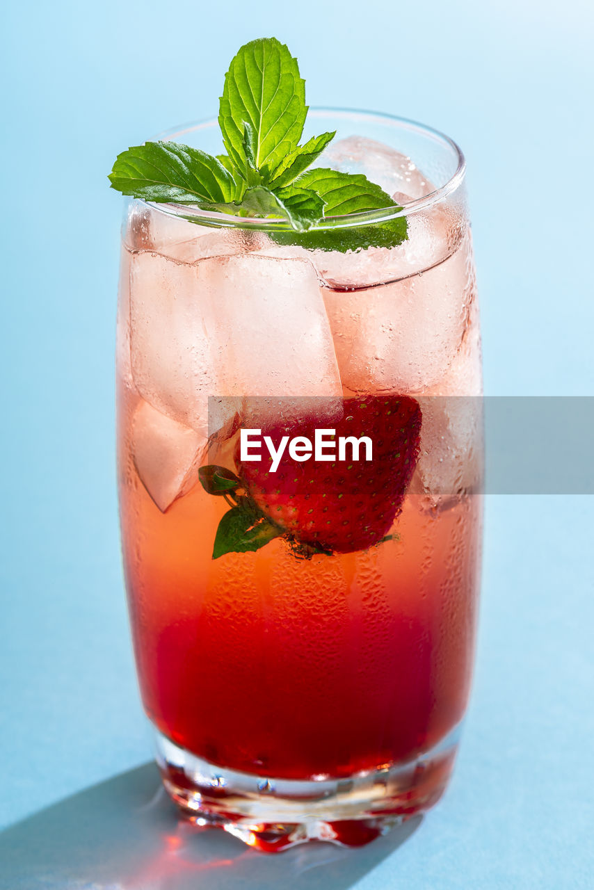 CLOSE-UP OF DRINK WITH GLASS OF JUICE