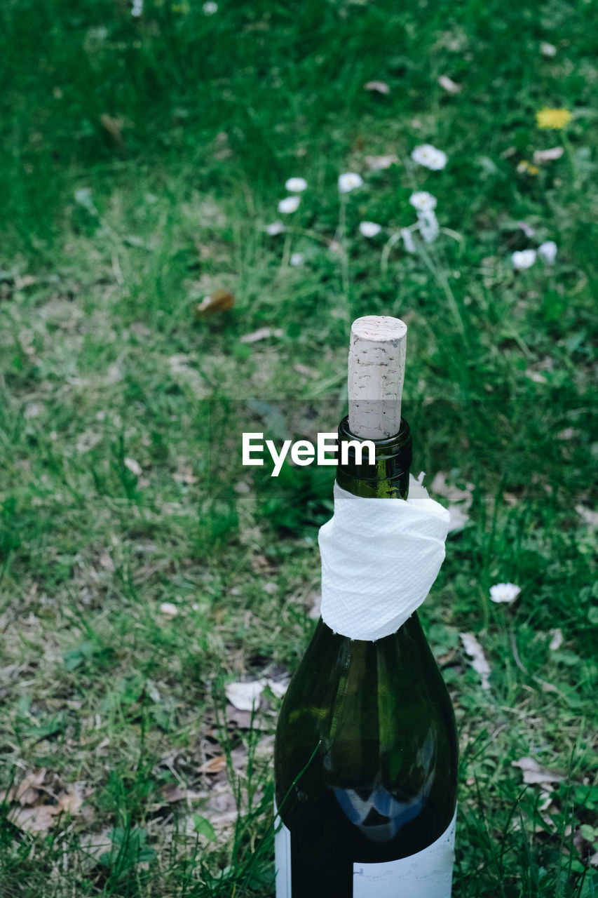 High angle view of wine bottle in the park