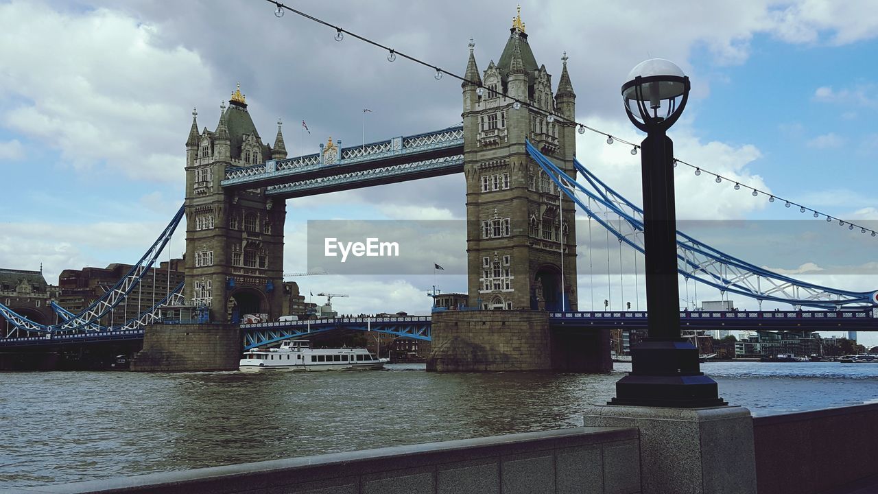 Tower bridge over thames river against sky