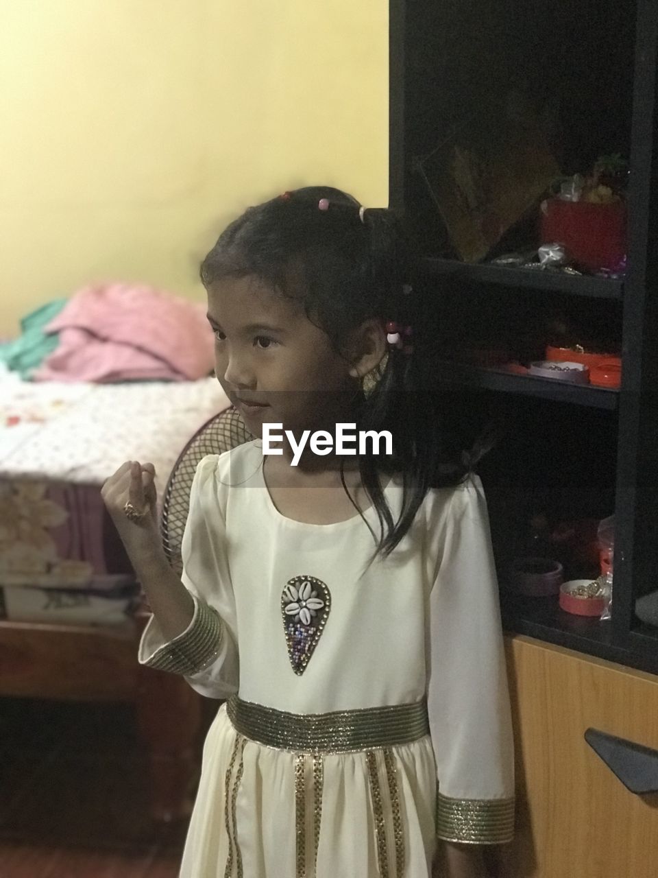 FULL LENGTH OF GIRL LOOKING AT HOME