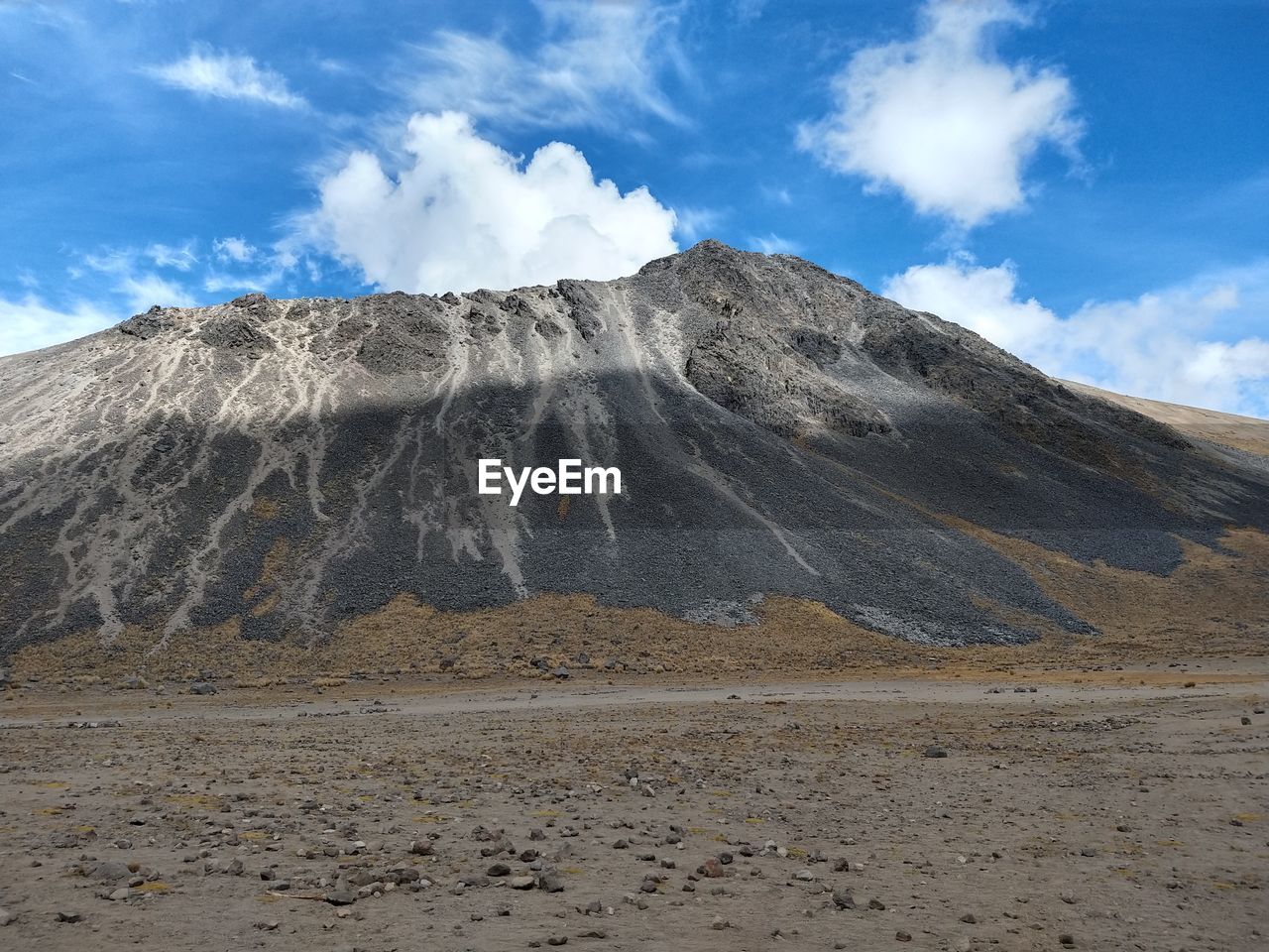 Scenic view of volcanic landscape against sky 