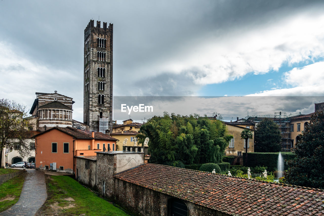 View of lucca historic center with the tower bell of the basilica of saint frediano, tuscany, italy