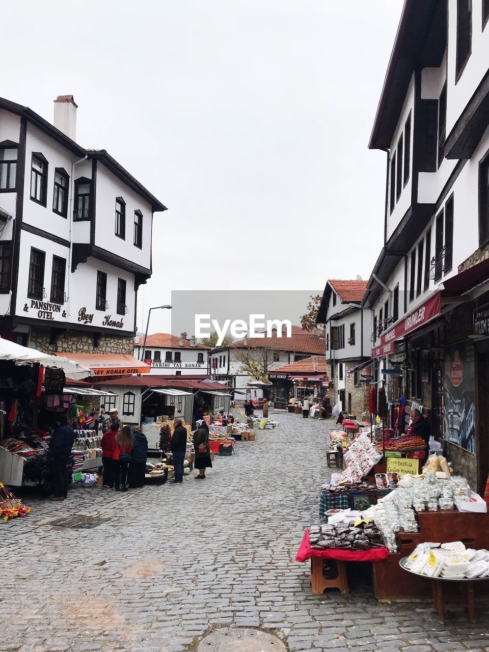 STREET MARKET AMIDST BUILDINGS IN CITY