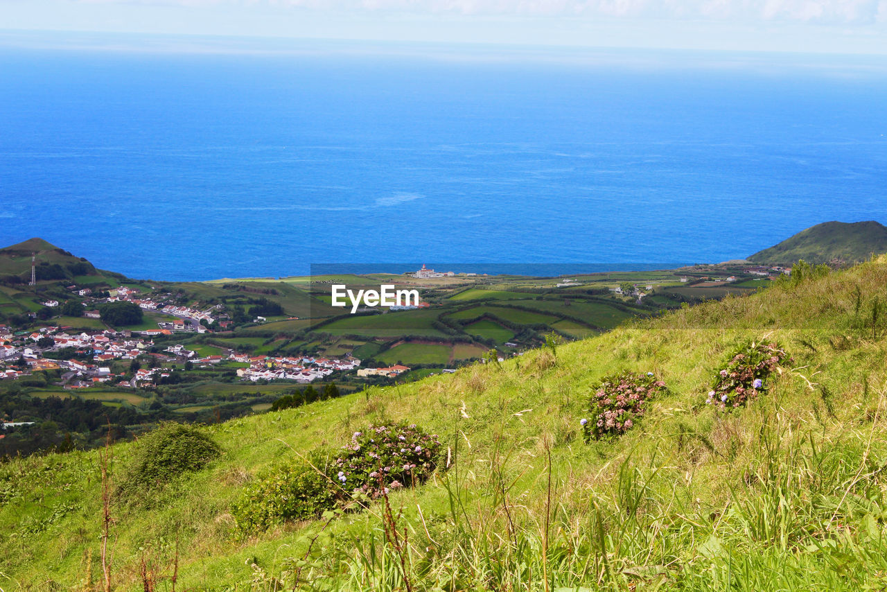 SCENIC VIEW OF LANDSCAPE AND SEA AGAINST SKY