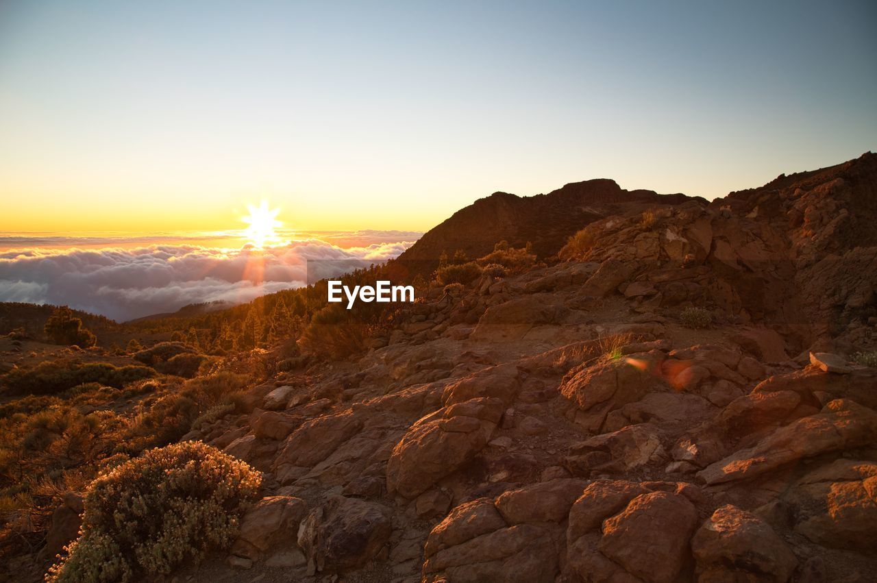 Scenic view of mountains against sky during sunset