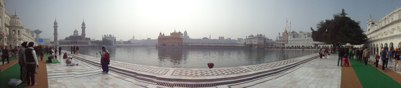 Panoramic view of pond at golden temple against sky