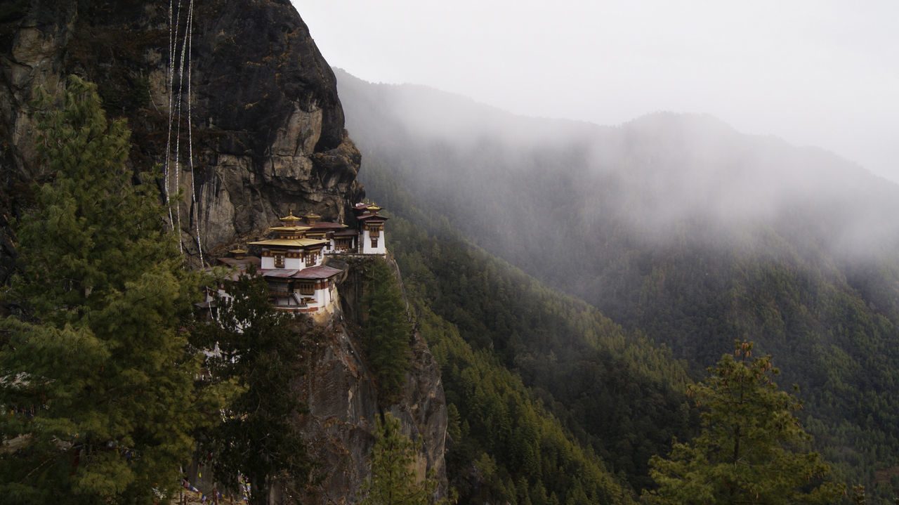 Scenic view of mountain against cloudy sky