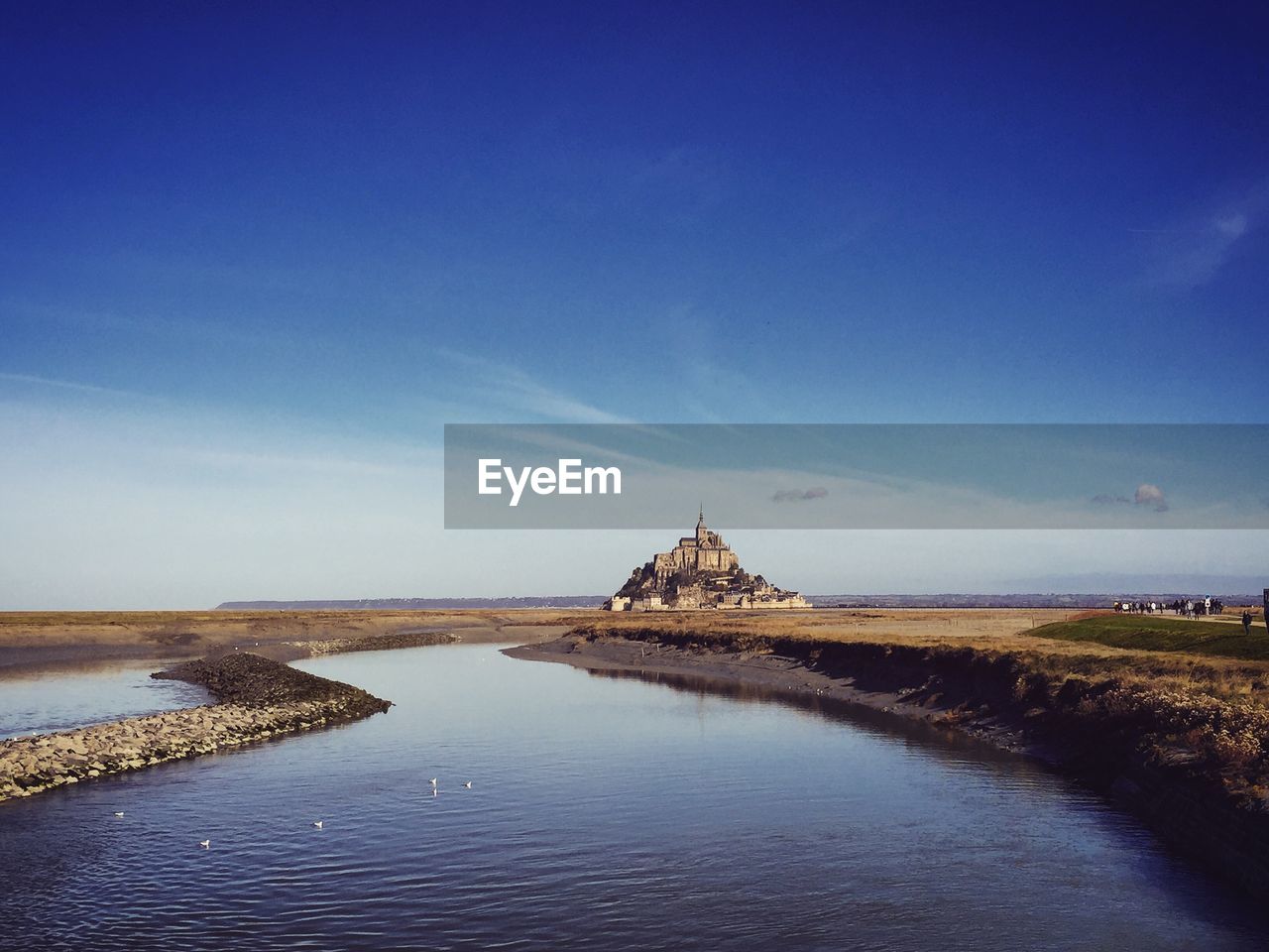 Mont saint-michel on field against sky