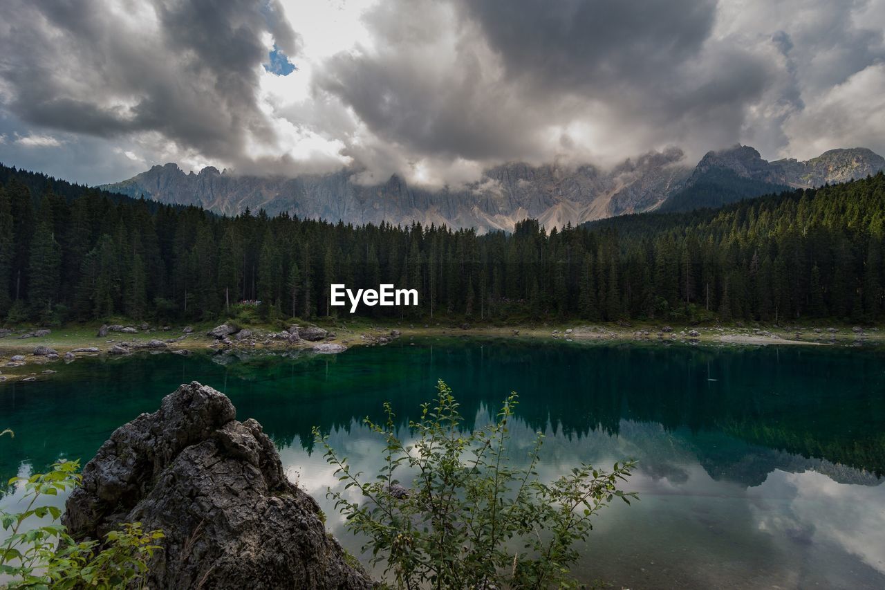 Scenic view of lake and mountains against sky