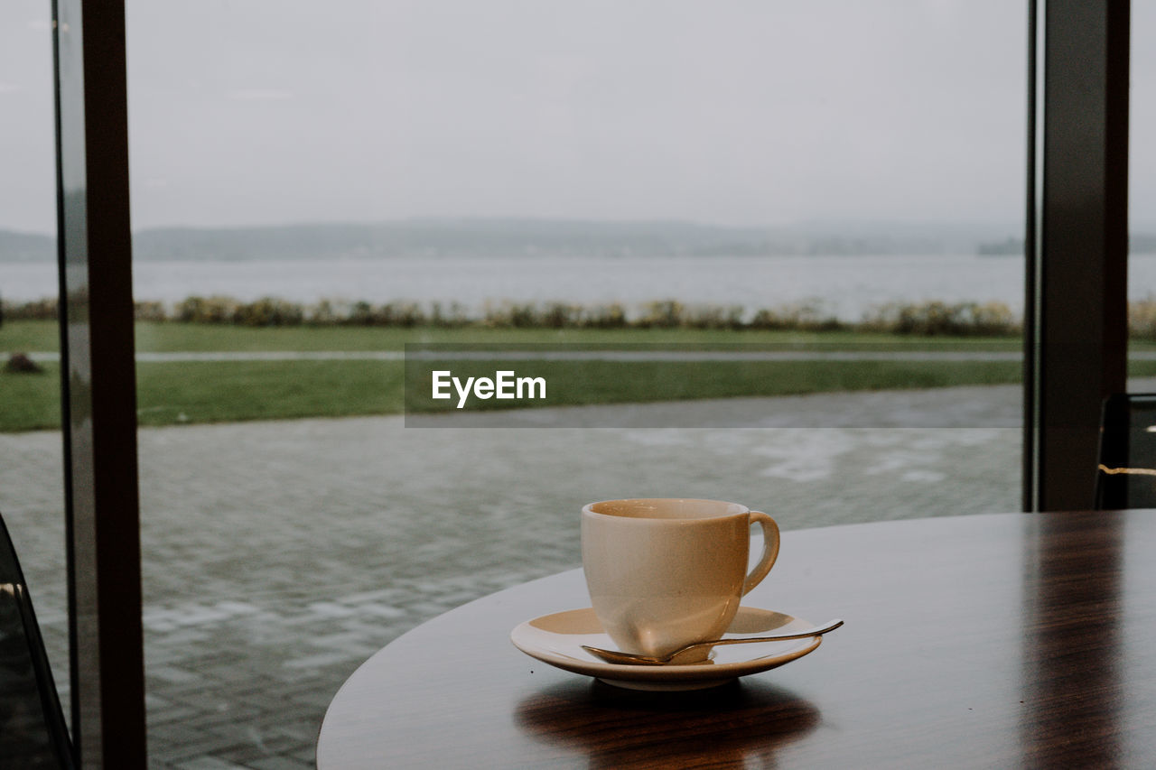 Close-up of coffee cup on table