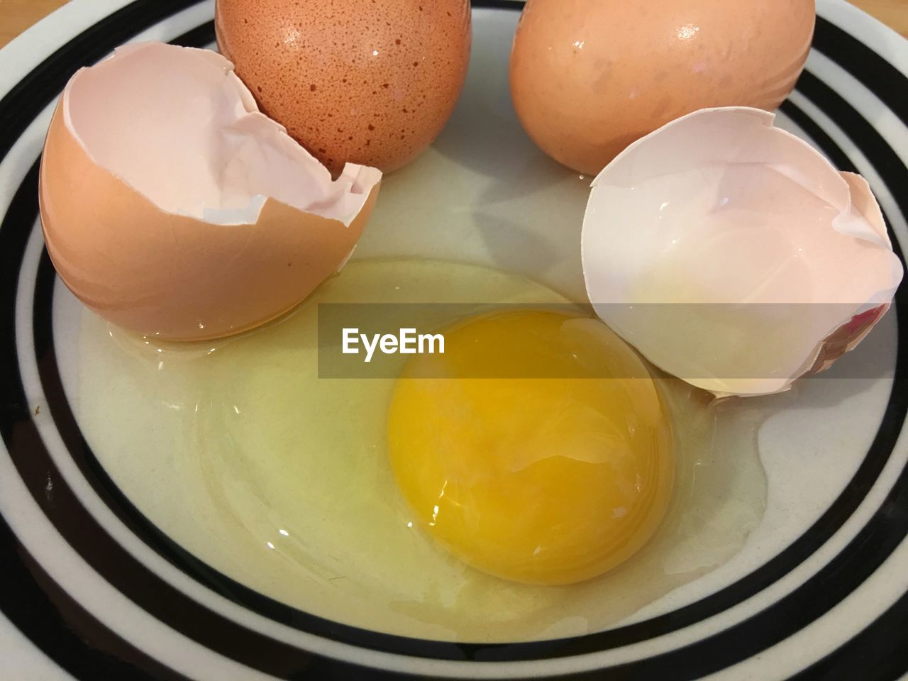 High angle view of eggs in plate