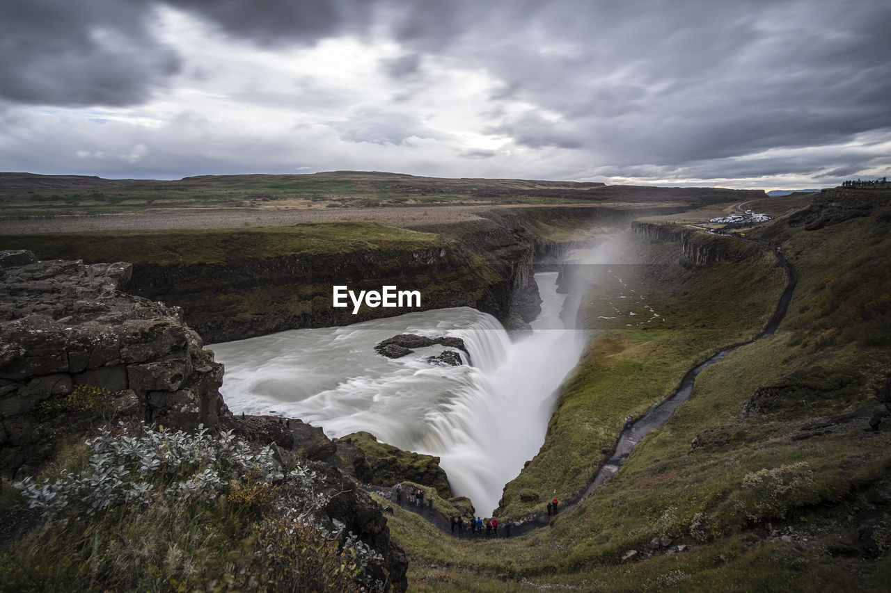 PANORAMIC SHOT OF WATERFALL AGAINST SKY