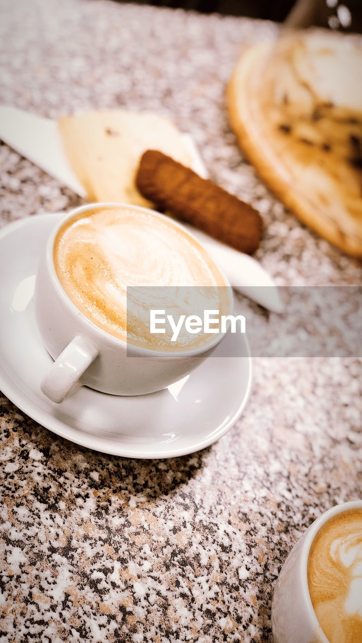 COFFEE CUP ON TABLE AT HOME