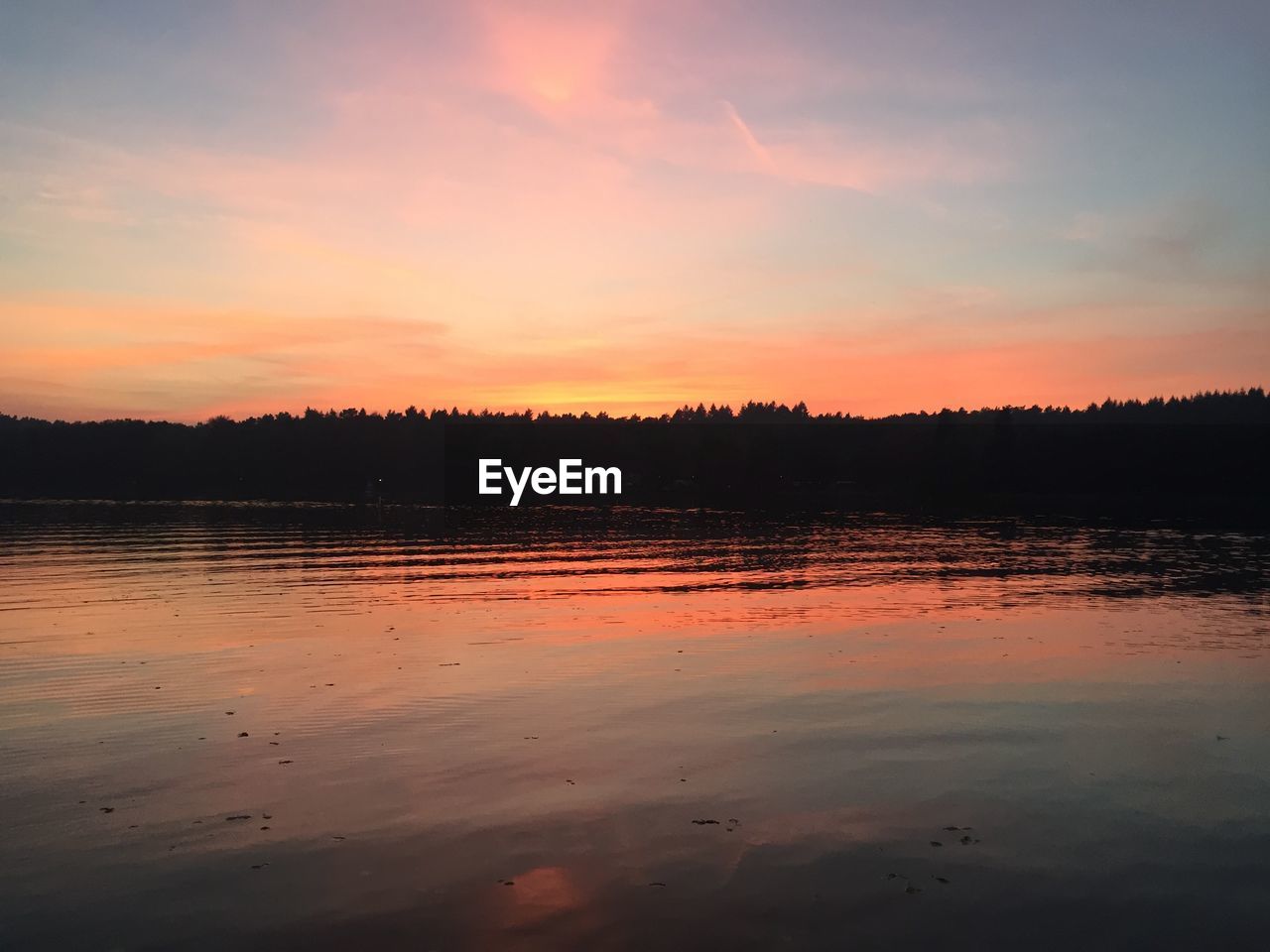 SCENIC VIEW OF LAKE AGAINST ORANGE SKY DURING SUNSET