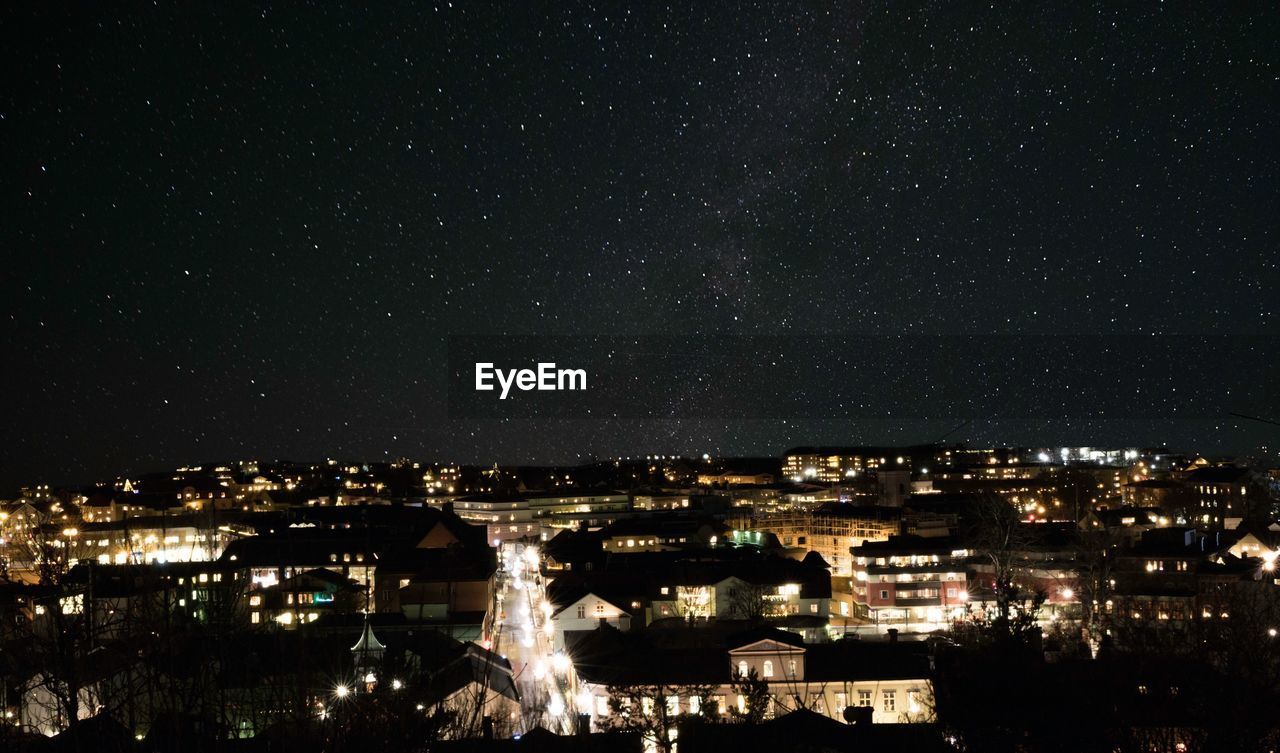 Aerial view of illuminated city at night