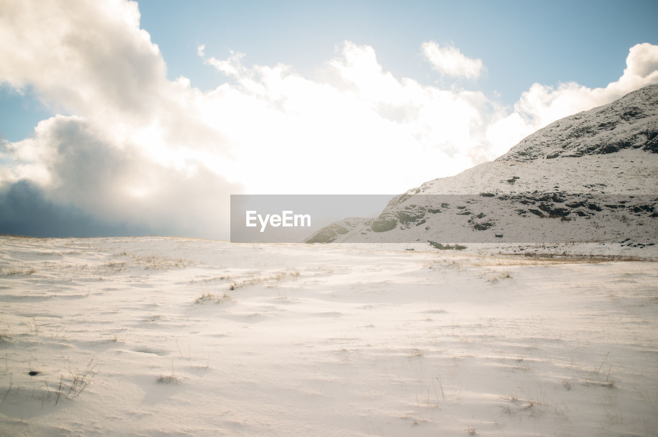 Scenic view of snow covered mountain against sky