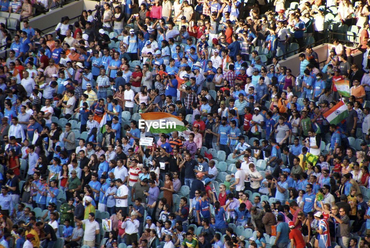 High angle view of spectators at stadium with indian flags