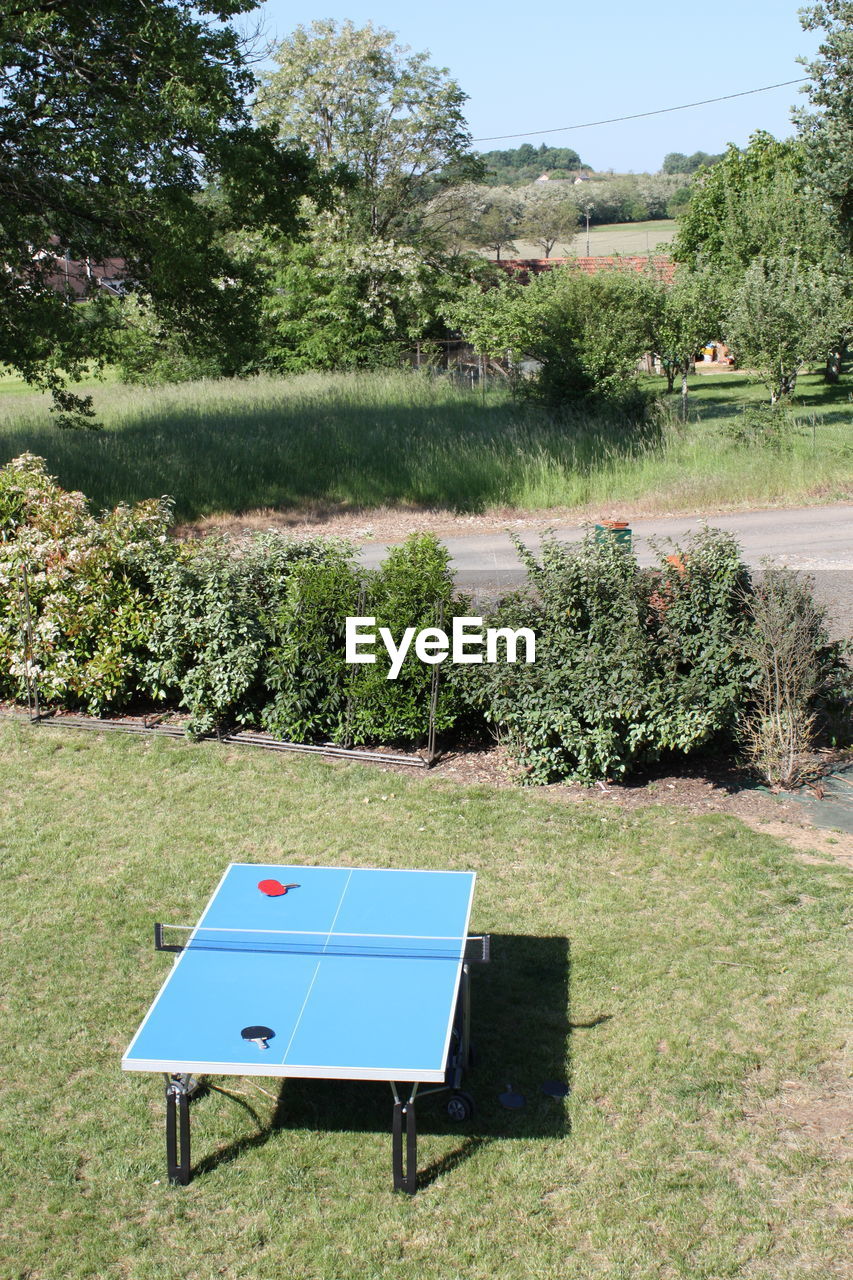 High angle view of table tennis table on grassy landscape