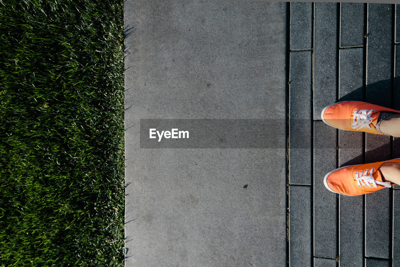 Low section of person standing on ground