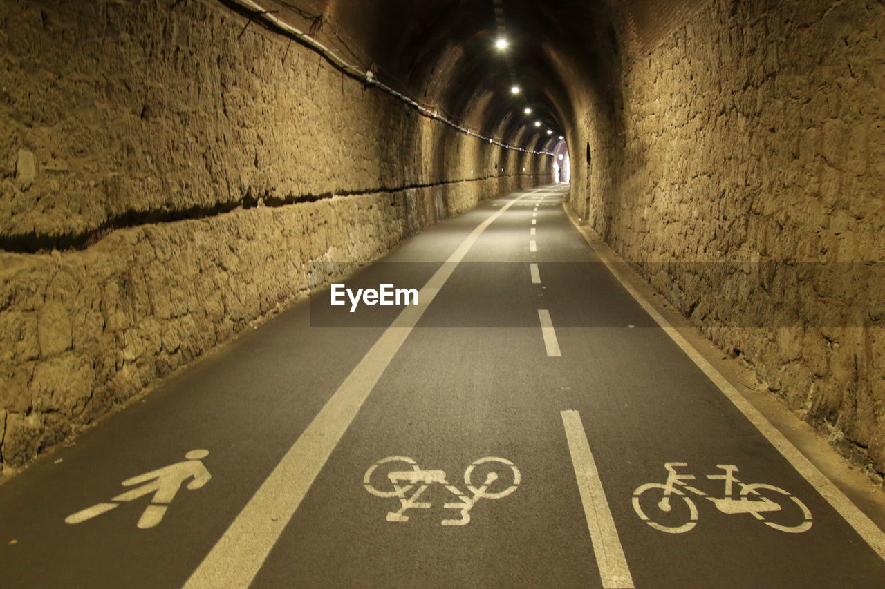 Ancient stone railway tunnel used as a trail for jogging and cycling