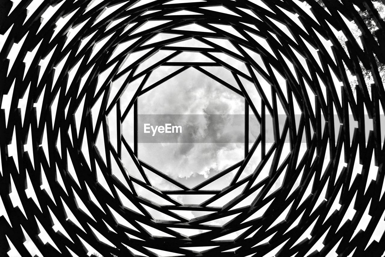 Low angle view of skylight against cloudy sky