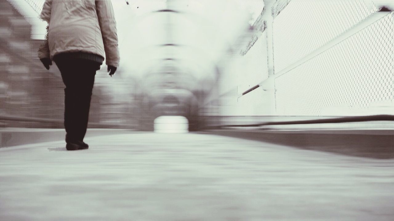 Low section of woman on elevated bridge