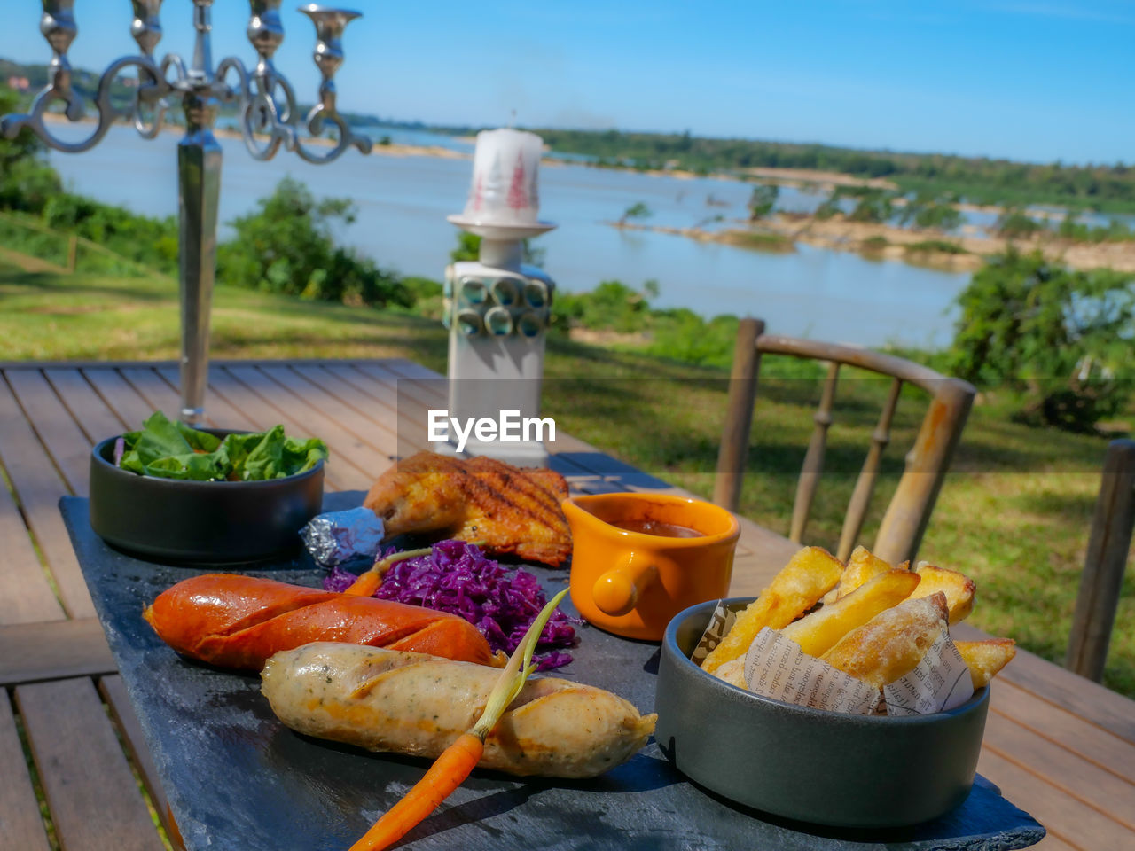 food and drink, food, nature, water, healthy eating, day, no people, freshness, table, plant, sky, summer, vegetable, wood, outdoors, wellbeing, focus on foreground, container, drink, fruit, meal, barbecue, household equipment, fast food