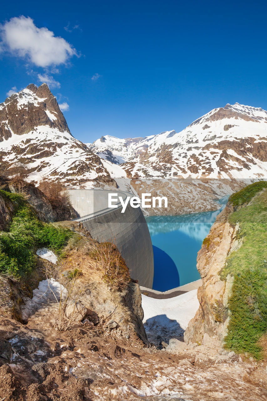 SCENIC VIEW OF MOUNTAINS AGAINST BLUE SKY