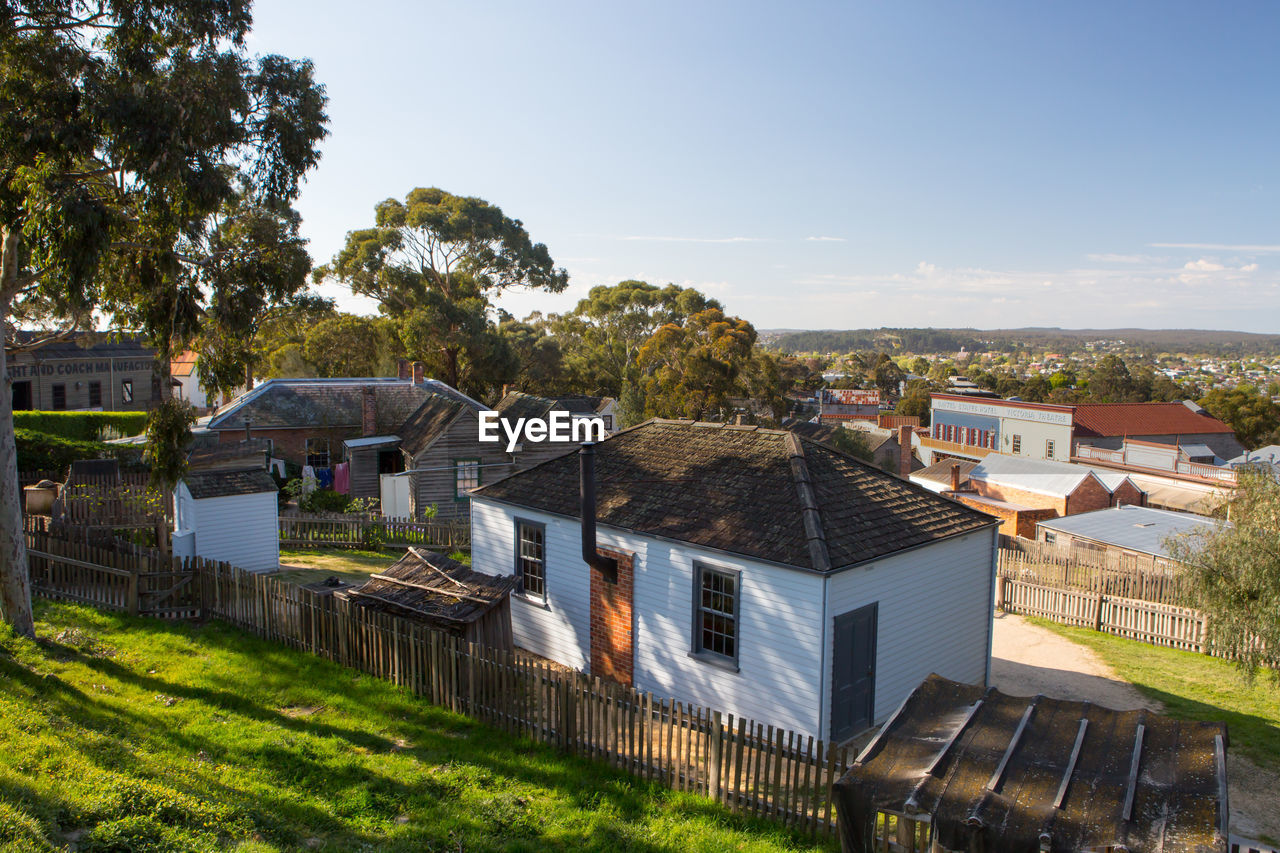 HOUSES IN TOWN AGAINST SKY