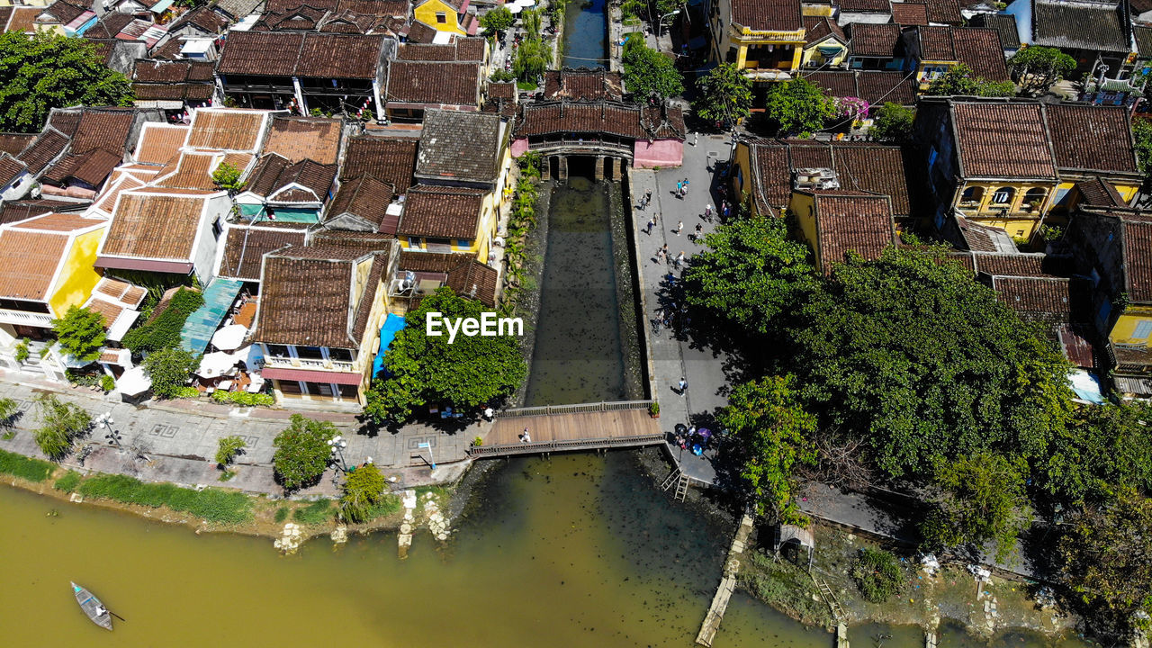 High angle view of canal by buildings in city