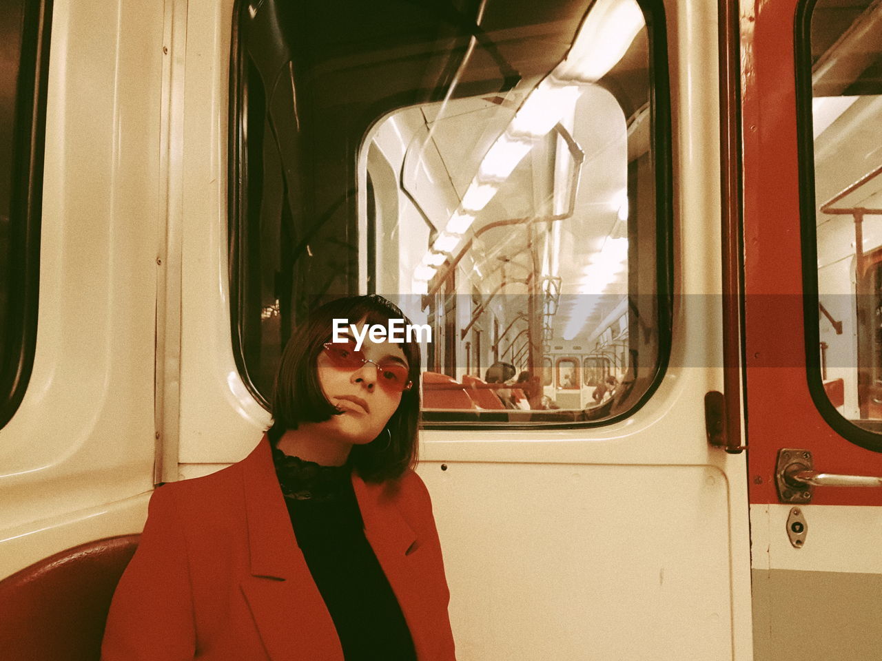 Portrait of woman sitting in train