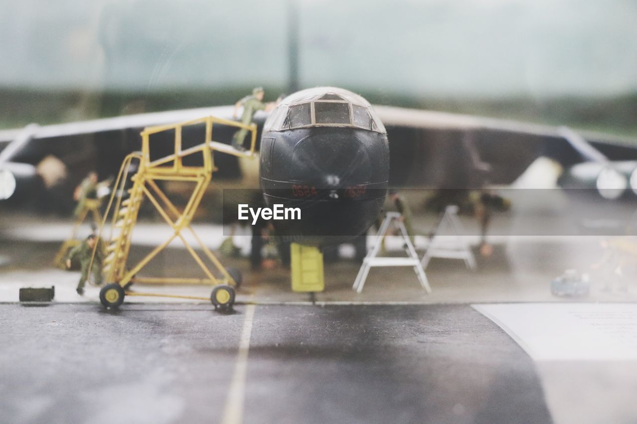 Close-up of airplane on floor in city