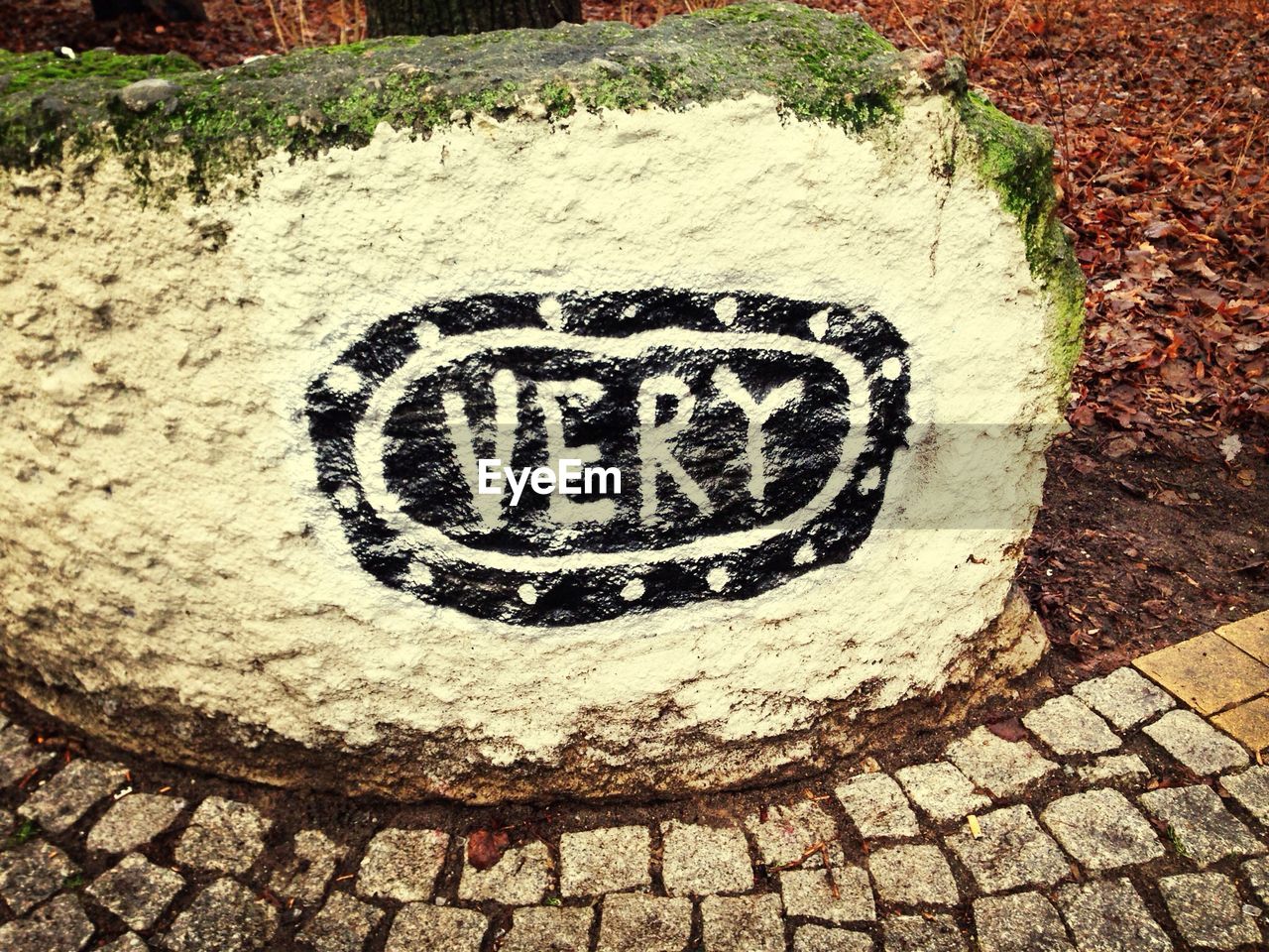 Text painted on rock outdoors