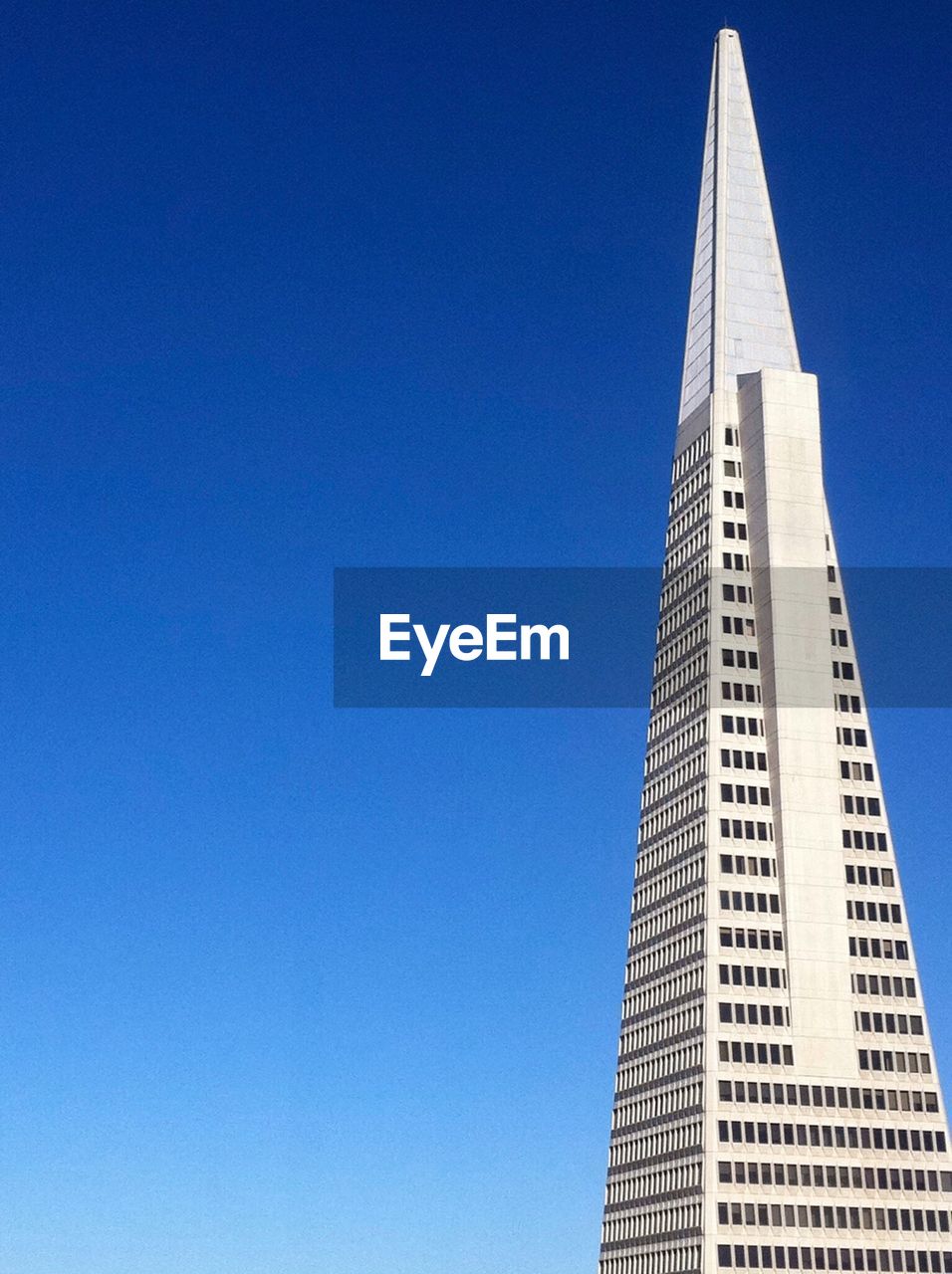 View of modern building against blue sky