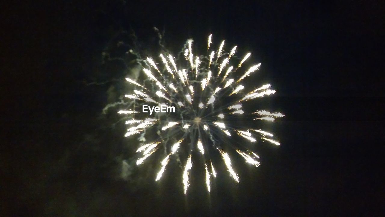 LOW ANGLE VIEW OF FIREWORKS DISPLAY