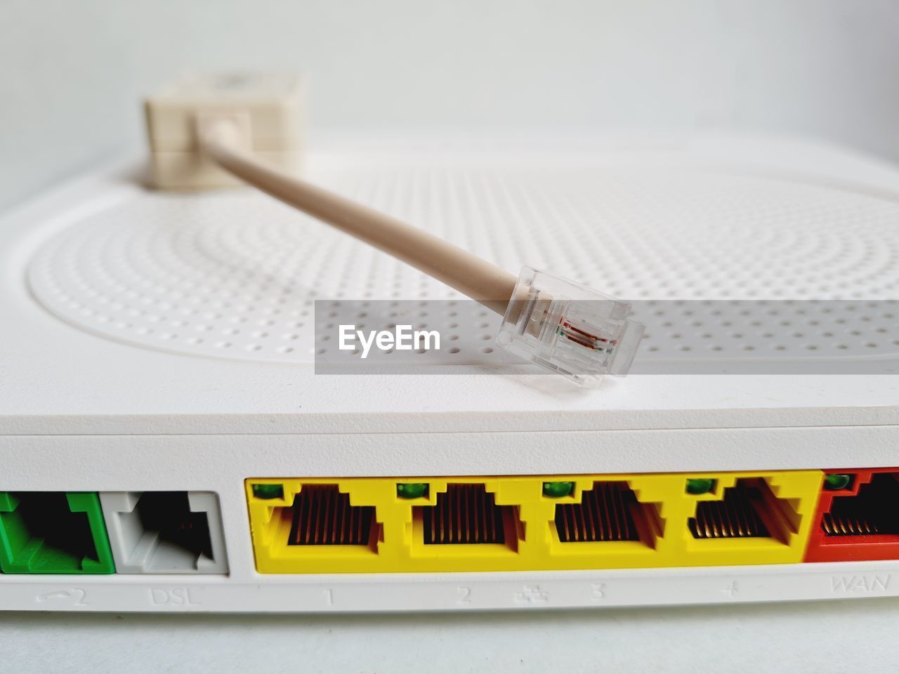 Back of a modem router with colored network cables