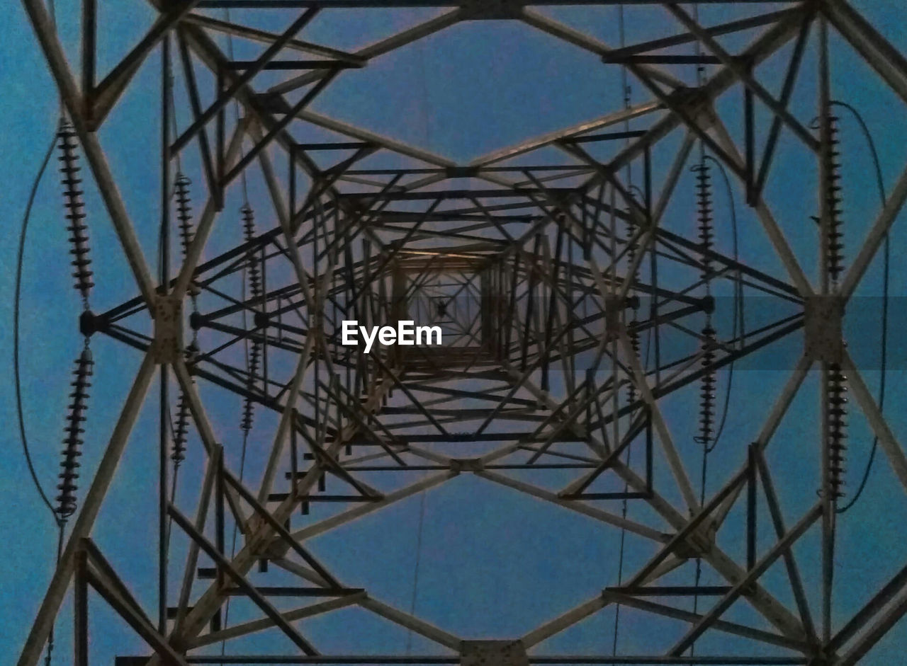 DIRECTLY BELOW SHOT OF ELECTRICITY PYLON