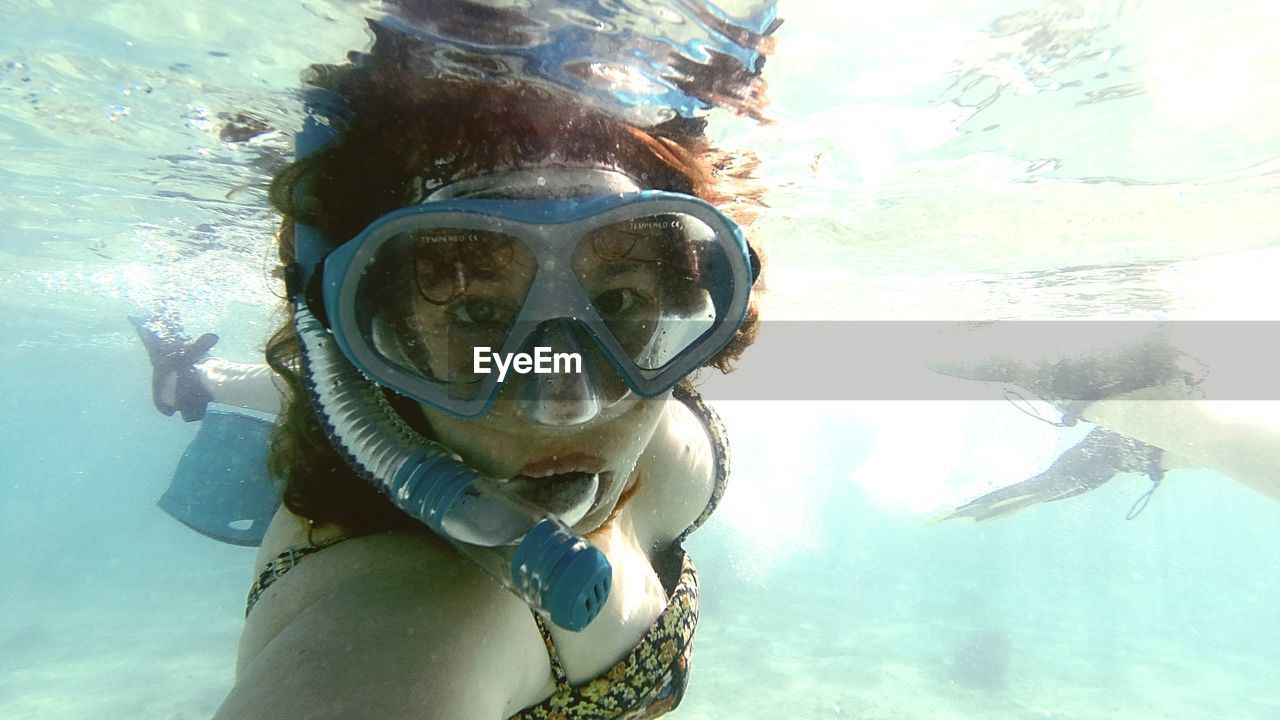 Portrait of a woman swimming in sea