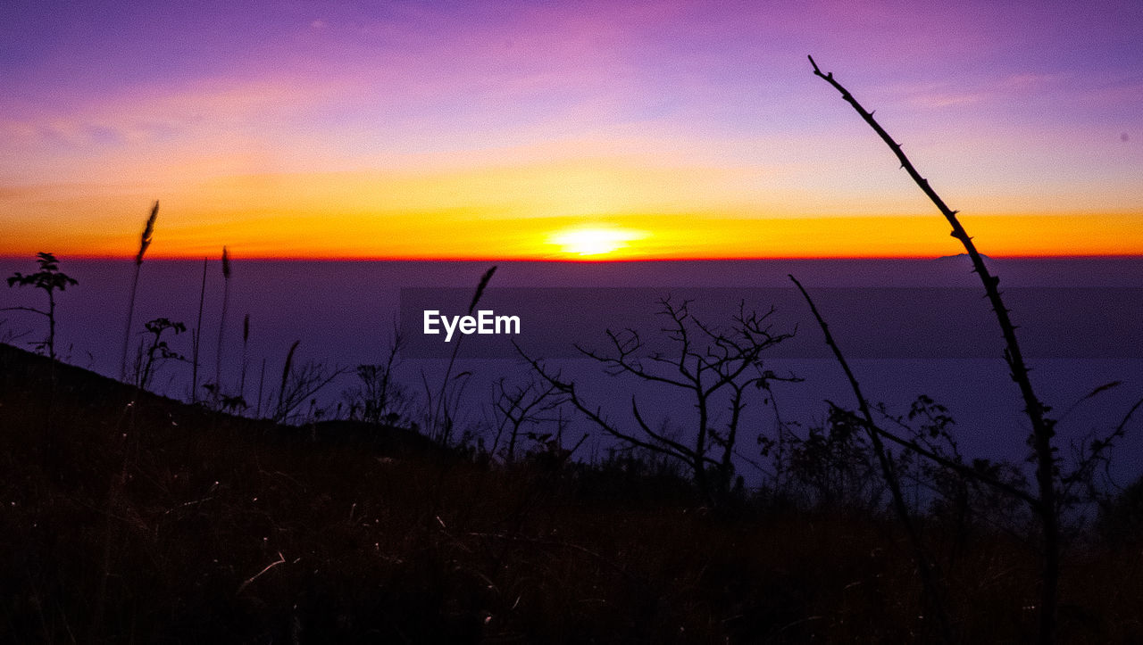 SCENIC VIEW OF LAKE AGAINST ROMANTIC SKY