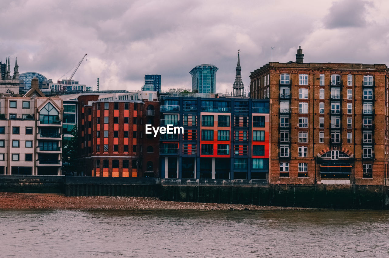 Buildings in city against sky