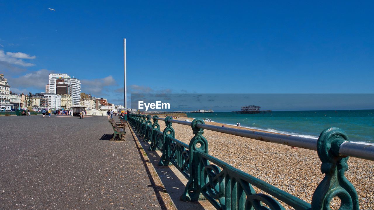 SCENIC VIEW OF SEA BY CITY AGAINST SKY