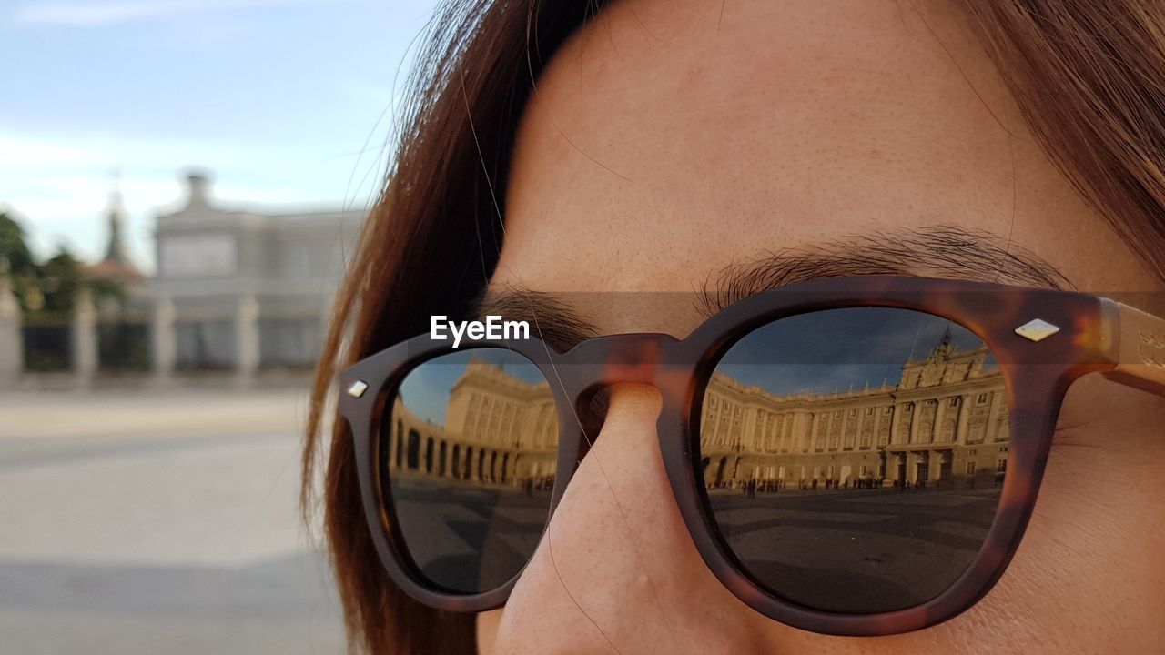 Close-up of young woman in sunglasses