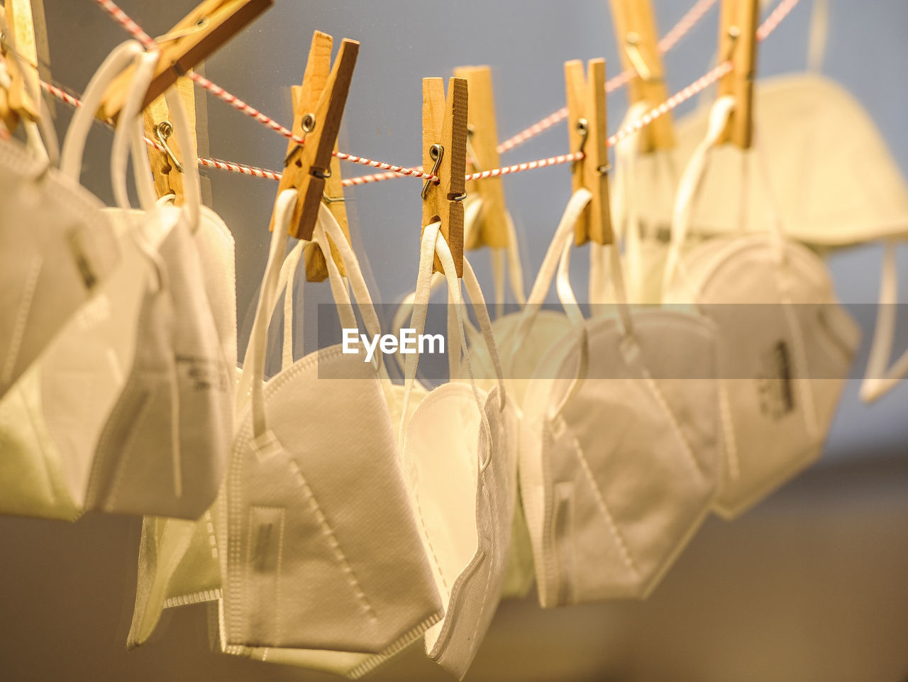 CLOSE-UP OF CLOTHES HANGING IN STORE