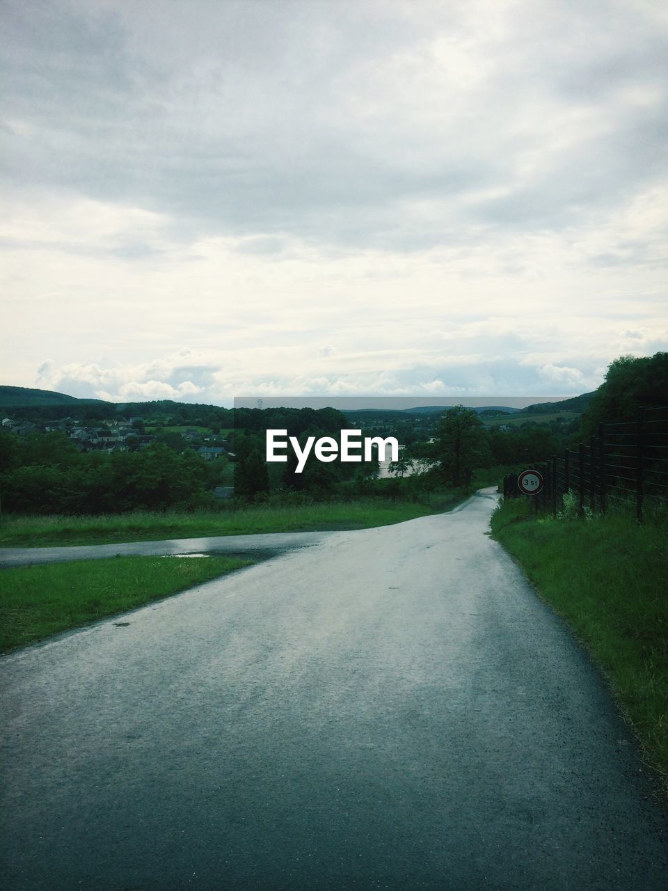 Empty country road along landscape