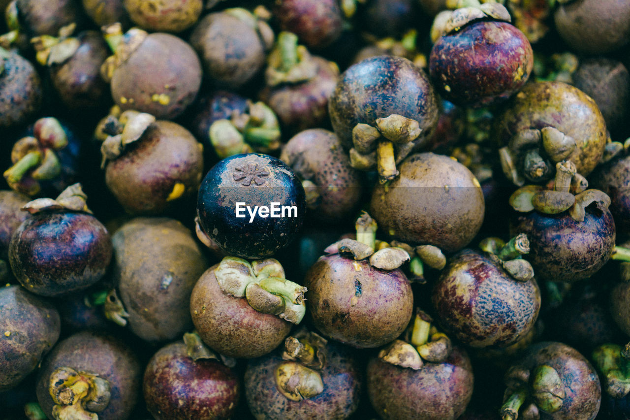 Full frame shot of mangosteens for sale at market stall