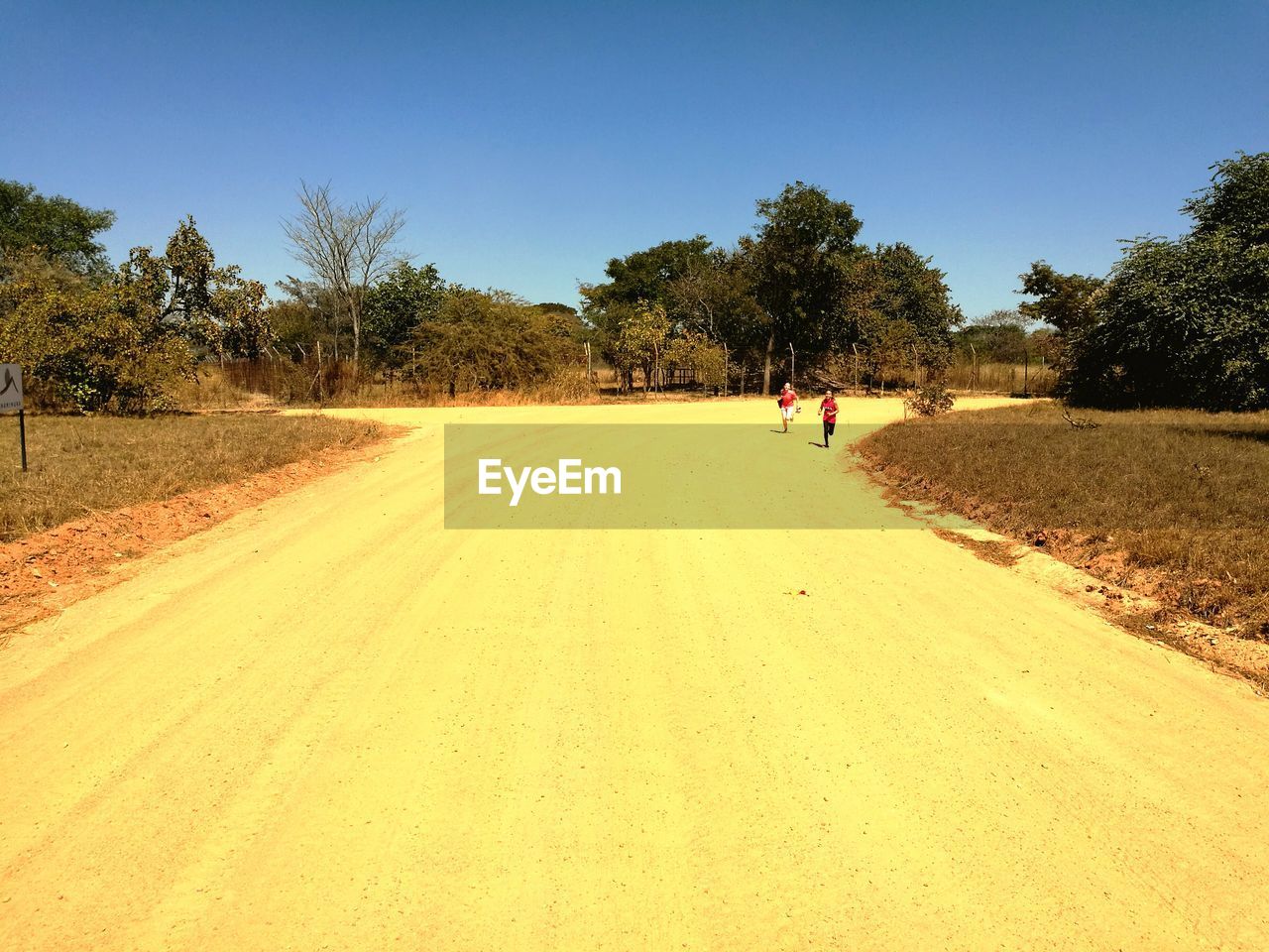 VIEW OF PEOPLE WALKING ON ROAD