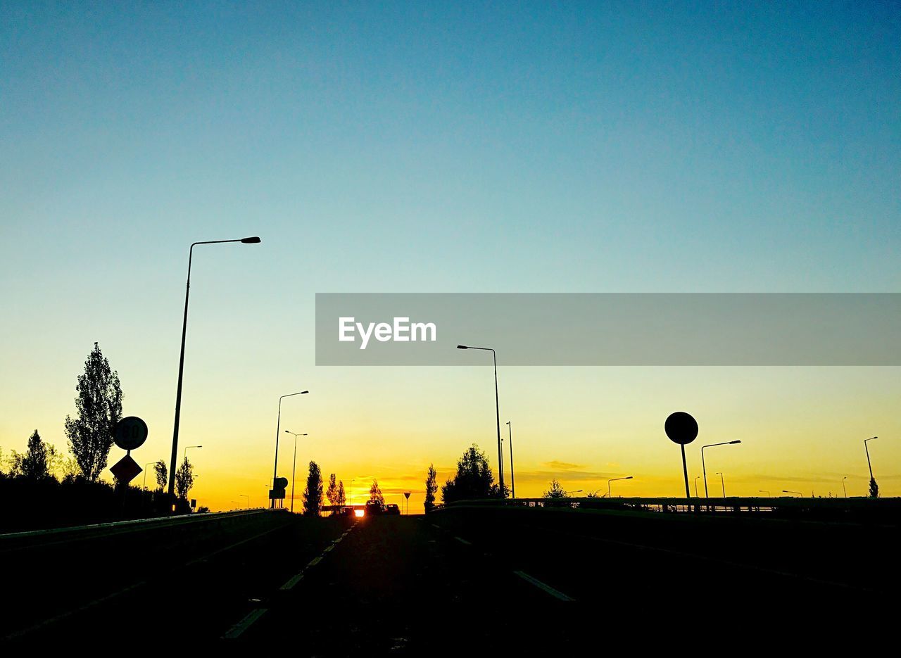 VIEW OF STREET AGAINST CLEAR SKY