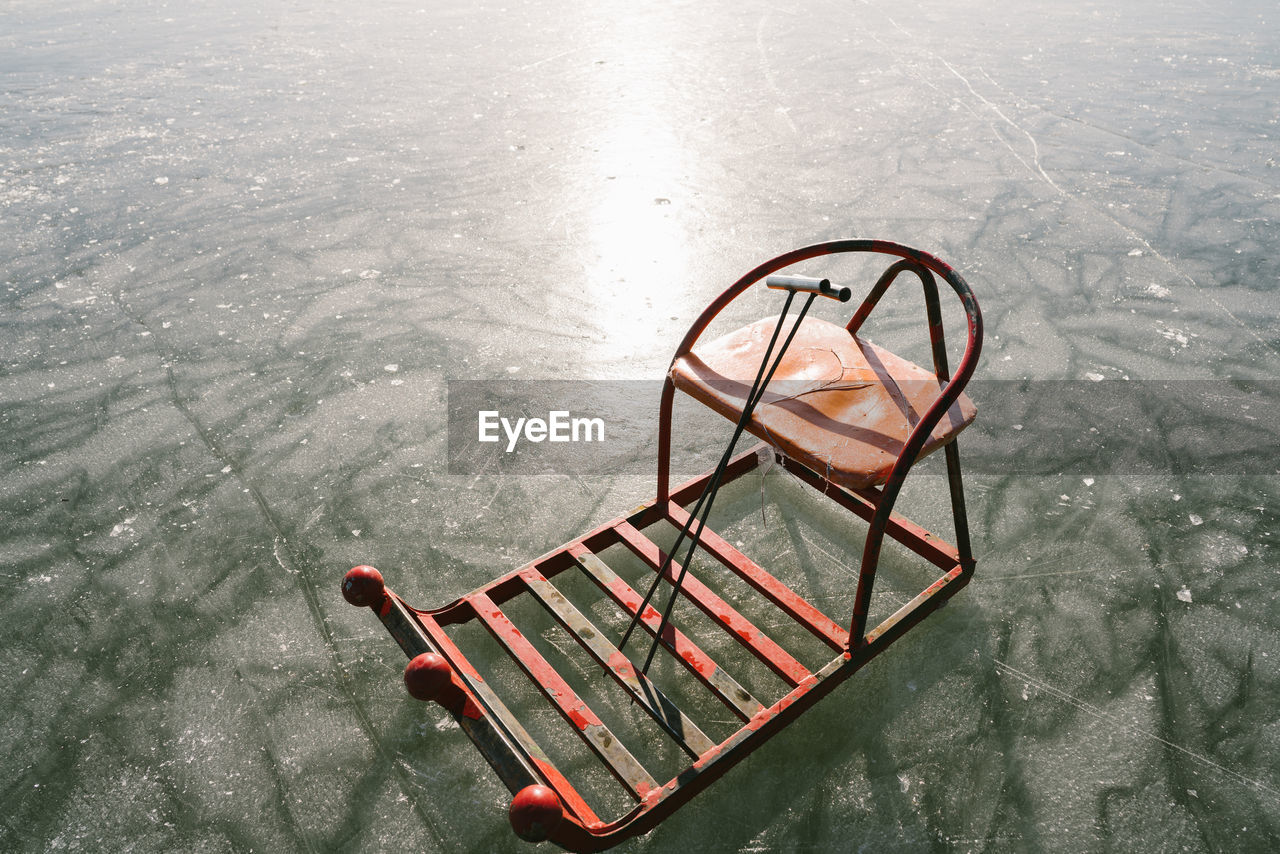 Sled on frozen lake