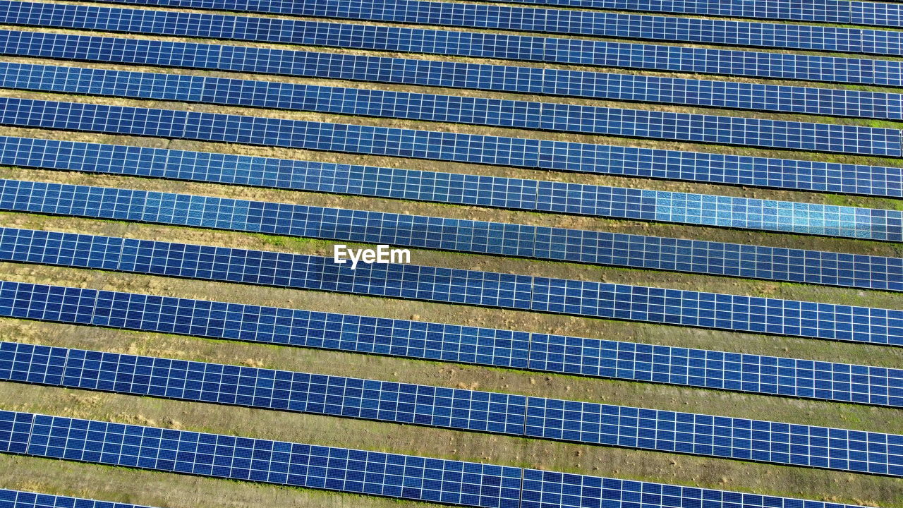 Aerial drone view flight over solar power station panels. aerial top view of solar farm green energy